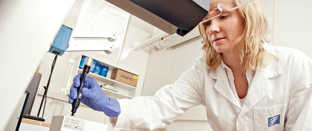 Woman in lab with pipette