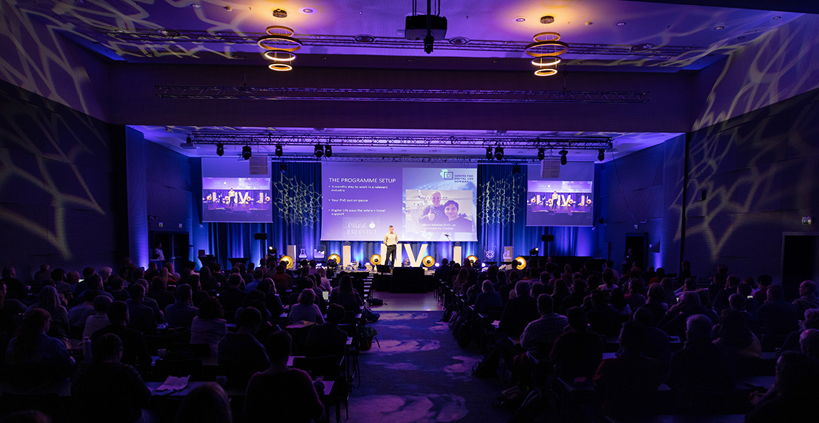 A man speaking in front of an audience