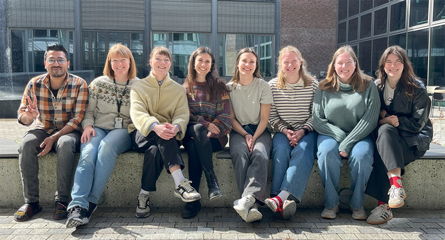 A group of people sitting outside