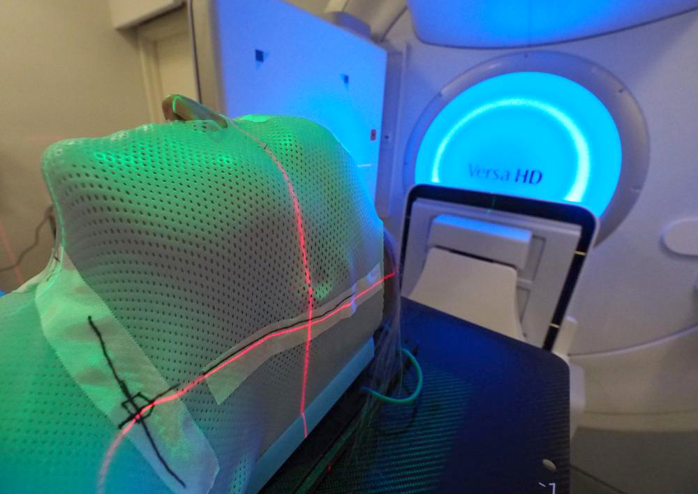 Dummy in an x-ray machine with radiation beam. Photo