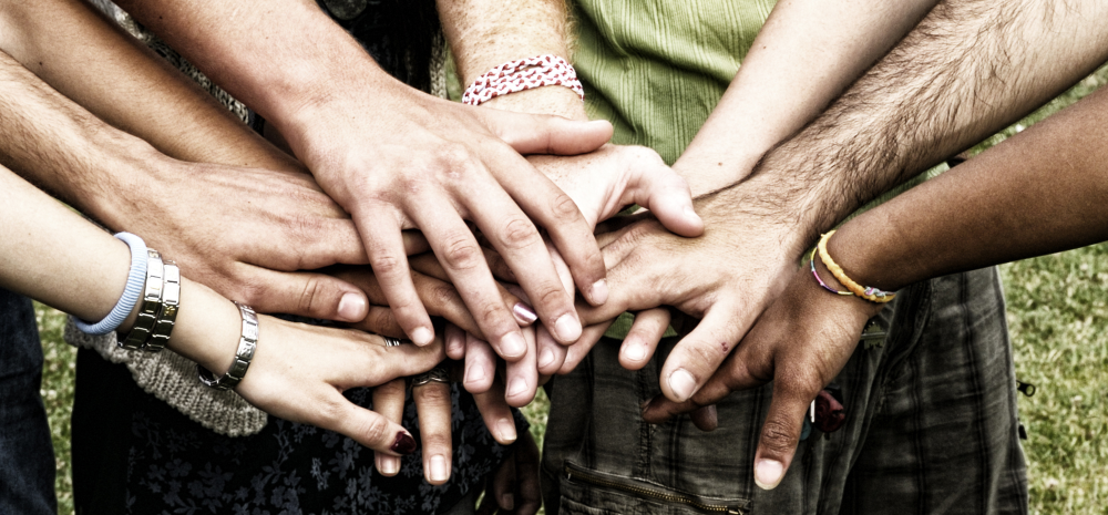 Picture of shaking hands, youths with different skin color