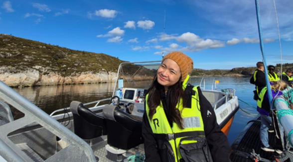 Picture of Naomy in a boat in Norway
