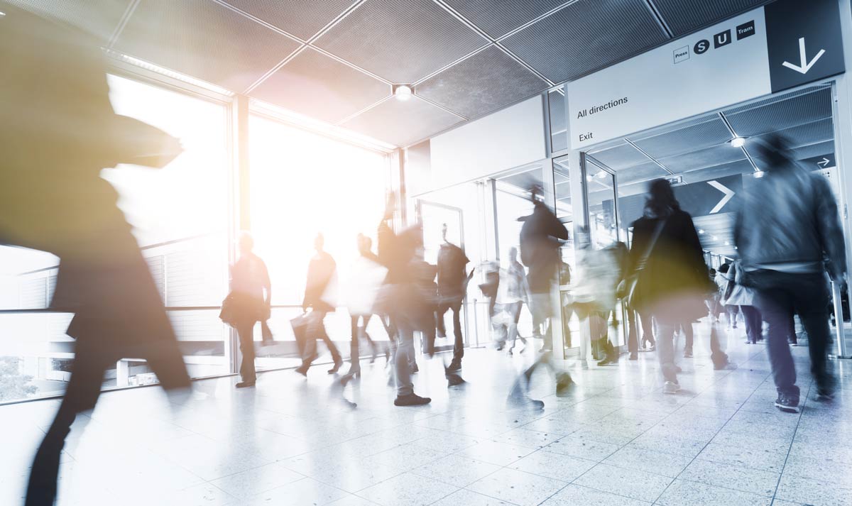 Blurred business people rushing in an airport entrance