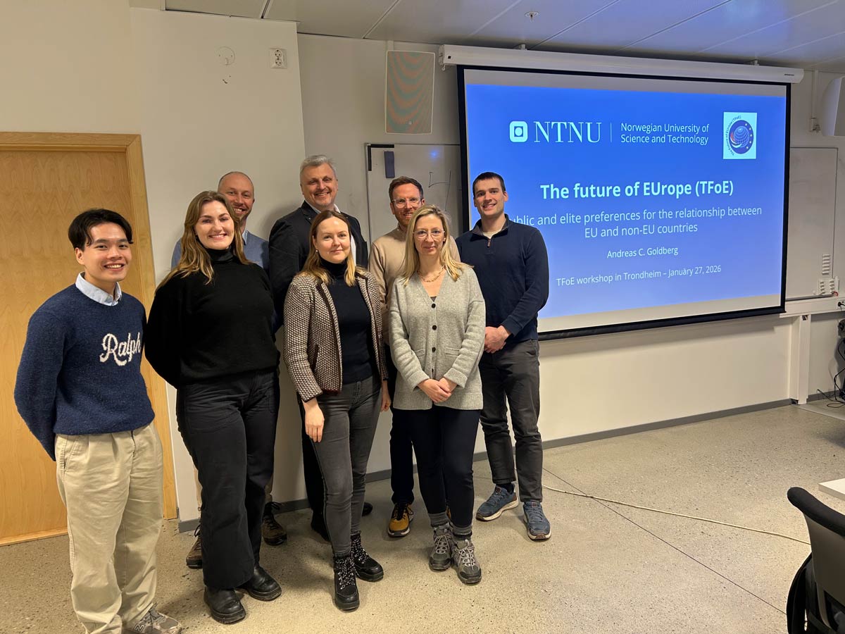 Photo. A group of people in front of a screen with the text "The future of EUrope (TFoE)"