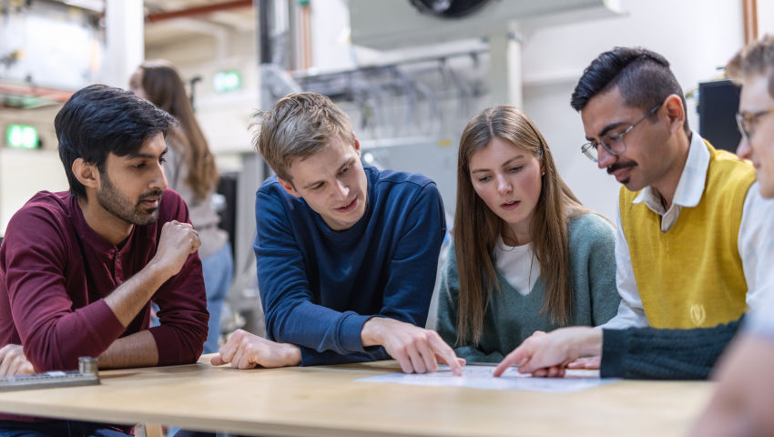 Students in the 2-year master's program in Sustainable Energy at NTNU in Trondheim. Collaborating on technical drawing of system solution for heat pumps in residential buildings, in the Thermodynamic laboratories.