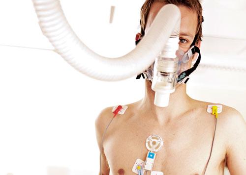 Man being tested in research lab with sensors and tubes