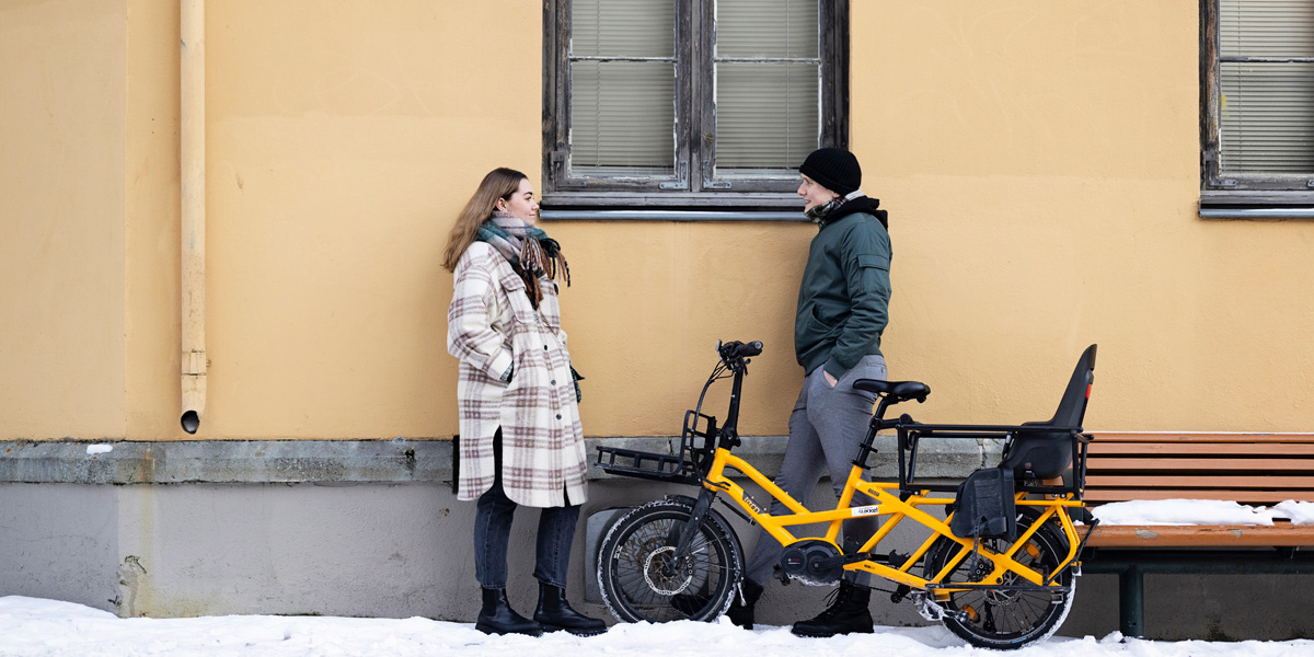 Students and a bike in a City landscape. Photo