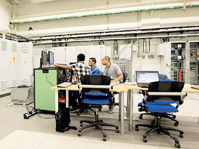 Three people in the Smart Grid Laboratory