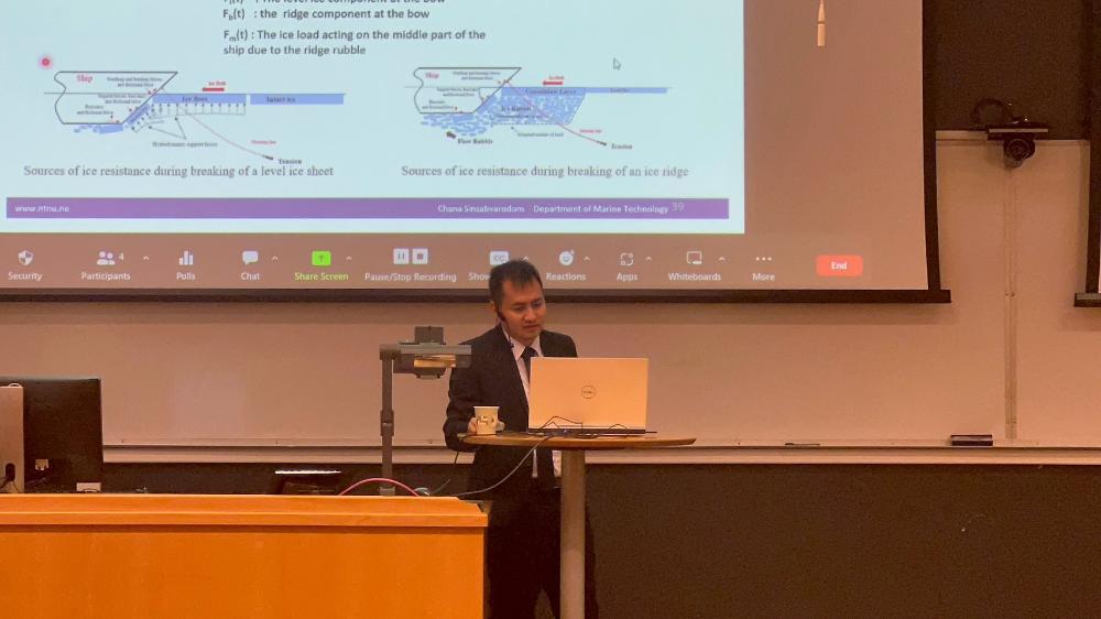 Chana Sinsabvaradom defending his PhD thesis.